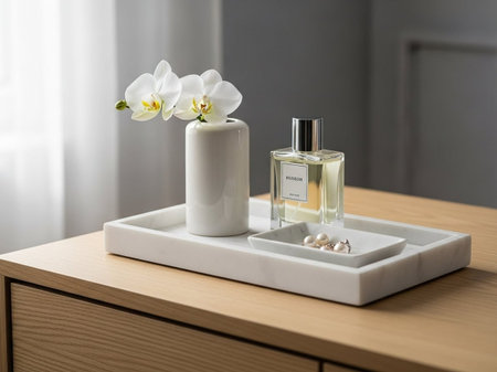 A serene and modern dressing table setup with orchids and perfume