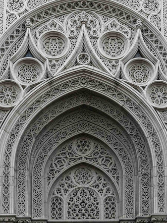 Intricately carved stone archway with ornate designs and patternsの写真素材