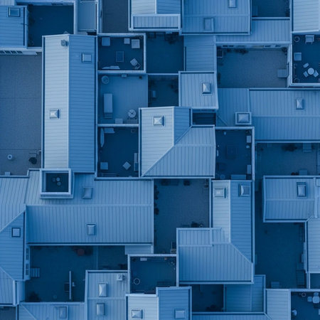 An aerial view of a densely packed urban neighborhood with blue rooftopsの写真素材