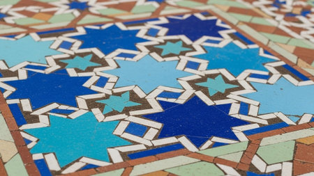 A vibrant mosaic tile floor with intricate geometric patterns and colorsの写真素材