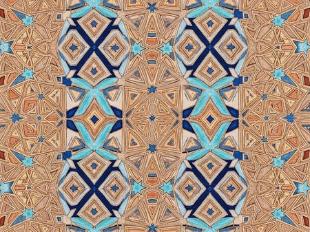 A vibrant and intricate geometric pattern with symmetrical designs and shapesの写真素材