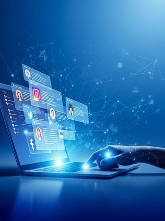 Robotic hand typing on laptop with social media iconsの写真素材