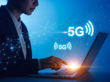 Person in suit using laptop with 5G signal icons