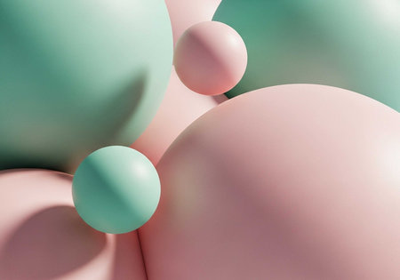 A colorful arrangement of pastel spheres in pink and green huesの写真素材
