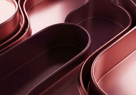 A close-up view of several red metal baking pans stacked togetherの写真素材