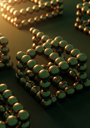 A close-up view of multiple strands of pearls arranged on a dark surface with warm lightingの写真素材