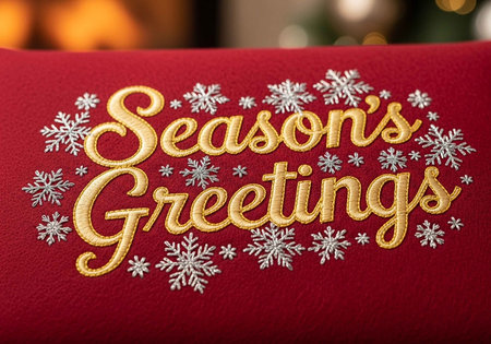 A festive holiday greeting card with snowflakes and gold letteringの写真素材