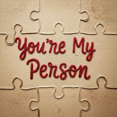 A puzzle piece with the words You're My Person embroidered on itの写真素材