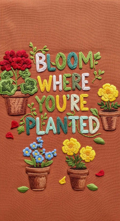 A colorful embroidered floral design with the phrase 'bloom where you're planted'の写真素材
