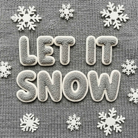 A festive holiday sweater with the phrase Let it Snowの写真素材