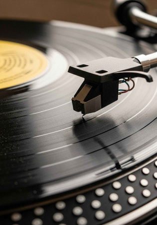 A close-up of a record player with a vinyl record spinningの写真素材
