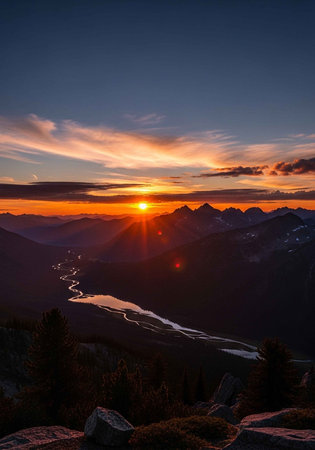 A serene mountain landscape at sunset with a winding river below