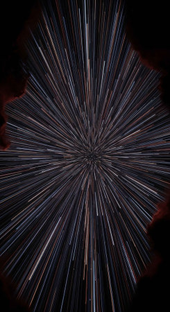 A dynamic fireworks explosion with bright, radiating sparks against a dark night sky.