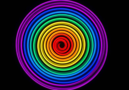 A mesmerizing, colorful spiral design with concentric circles in rainbow hues.