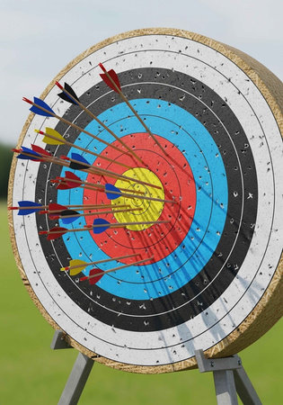 Close-up of a target with multiple arrows in various colors hitting the bullseye and surrounding...