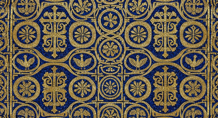 Detailed gold and blue mosaic pattern featuring crosses, floral, and geometric designs.の写真素材