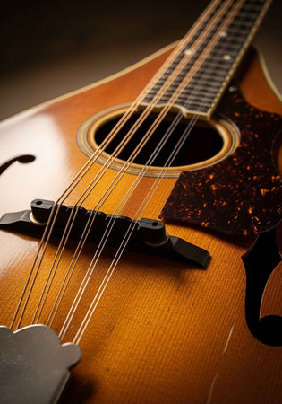 A close-up view of an acoustic guitar with a warm and inviting lighting