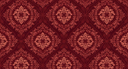 A vibrant red and gold floral patterned fabric with intricate designs and shapesの写真素材