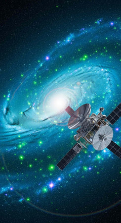 A satellite orbits a vibrant galaxy in the vastness of outer space at nightの写真素材