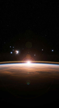 A breathtaking view of the Earth from space with a bright sun shiningの写真素材