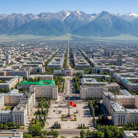 Aerial view of a city with a large square and mountains in the backgroundの写真素材
