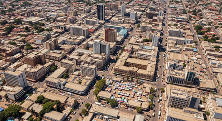 Aerial view of a bustling city with modern buildings and urban landscapeの写真素材