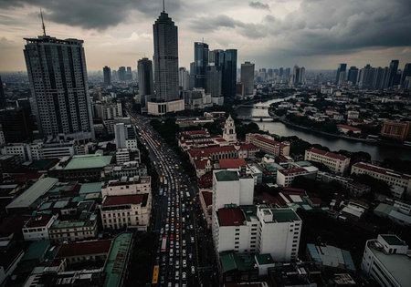 Aerial view of a bustling cityscape with skyscrapers and busy streets on a cloudy day