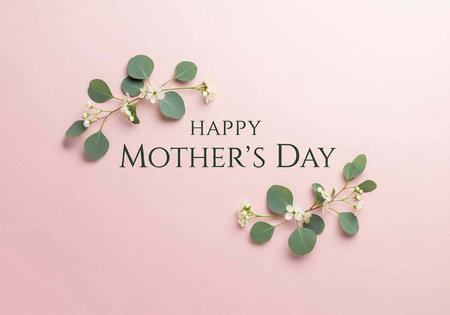 A Happy Mother's Day greeting card with flowers and leaves on a pink backgroundの写真素材