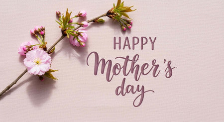 A beautiful Happy Mother's Day message with pink flowers on a soft background