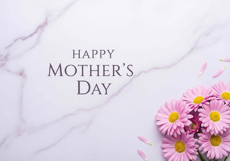 A Happy Mother's Day message with pink flowers on a white marble surfaceの写真素材