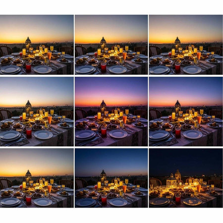 A beautifully set table with candles and plates during a serene sunset eveningの写真素材
