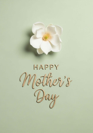 A white flower with yellow center and Happy Mother's Day text on light green backgroundの写真素材