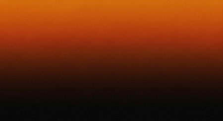 A vibrant orange and black gradient background with a dramatic sunset effect