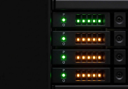 A server with multiple rows of green and orange lights on a dark background