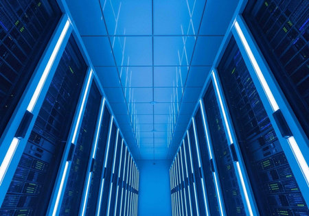 Rows of server racks with glowing blue lights in a data center hallway or corridor