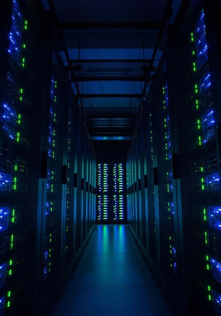 A dark server room with rows of computer servers and blue and green lights