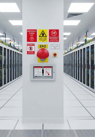 A large server room with a prominent emergency shutdown panel on the wall