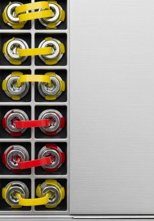 A close-up view of a battery pack with yellow and red connectors