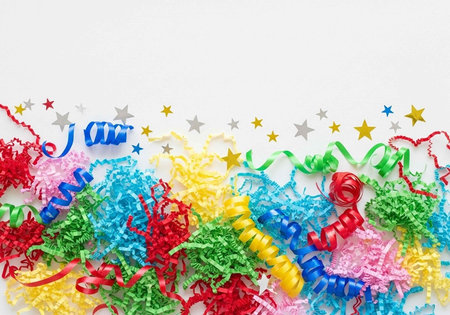 Vibrant party decorations including curly streamers, confetti, and star shapes in various colorsの写真素材