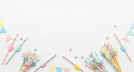 Pastel-colored spoons, stars, and bunting flags arranged on a white surface for festive occasions.