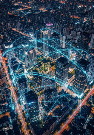 City at night with blue network lines, skyscrapers, and illuminated streets from an aerial...