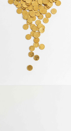 A pile of gold coins spilling down on a white background