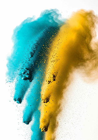 Colorful blue and yellow powder exploding in mid-air against a clean white backdrop