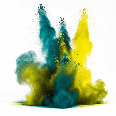 Colorful yellow and teal powder exploding in mid-air against a white backdrop