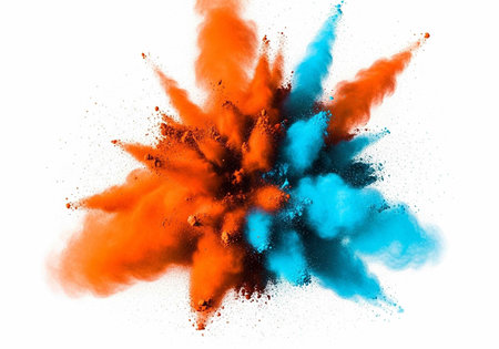 Colorful orange and blue powder explodes in a dynamic, abstract composition.