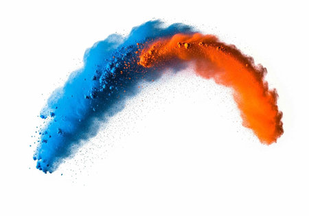 Colorful blue and orange powder explodes in an arc shape on a clean white surface