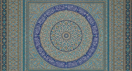 Intricate blue and gold Islamic geometric pattern on a decorative tile or rug with floral motifs and...