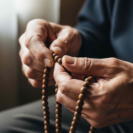 A person holding a wooden rosary in their hands, praying or meditating in a peaceful and serene...