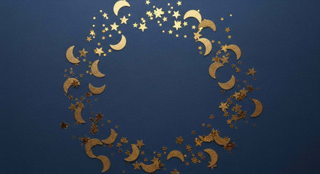 A wreath of gold crescent moons and stars on a dark blue textured background with empty space