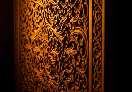 Golden floral pattern on dark background, showcasing intricate design and luxury texture